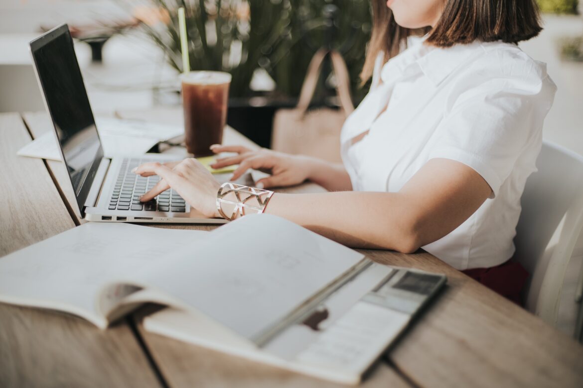 woman using her computer to do work